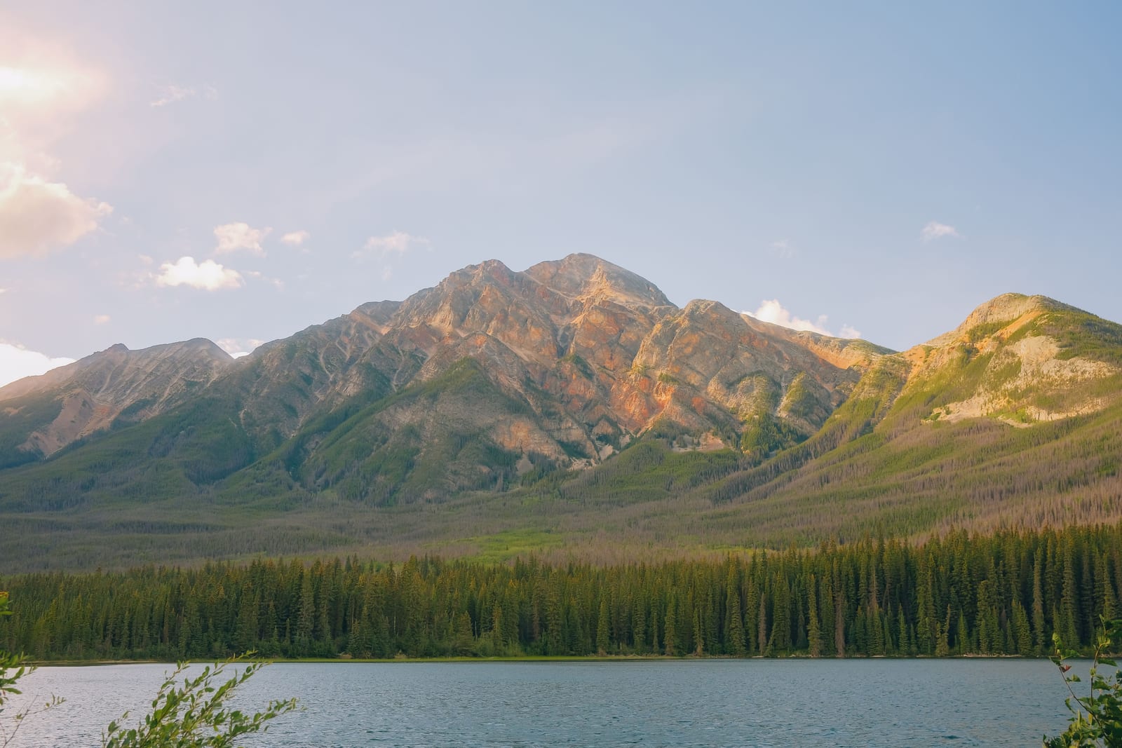 Golden-hour mountain above a calm lake