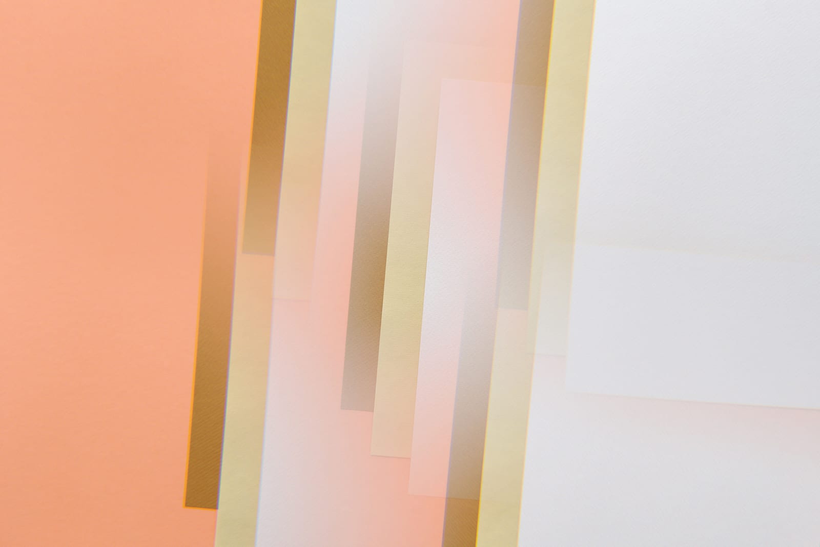 Translucent vertical paper strips over coral and white