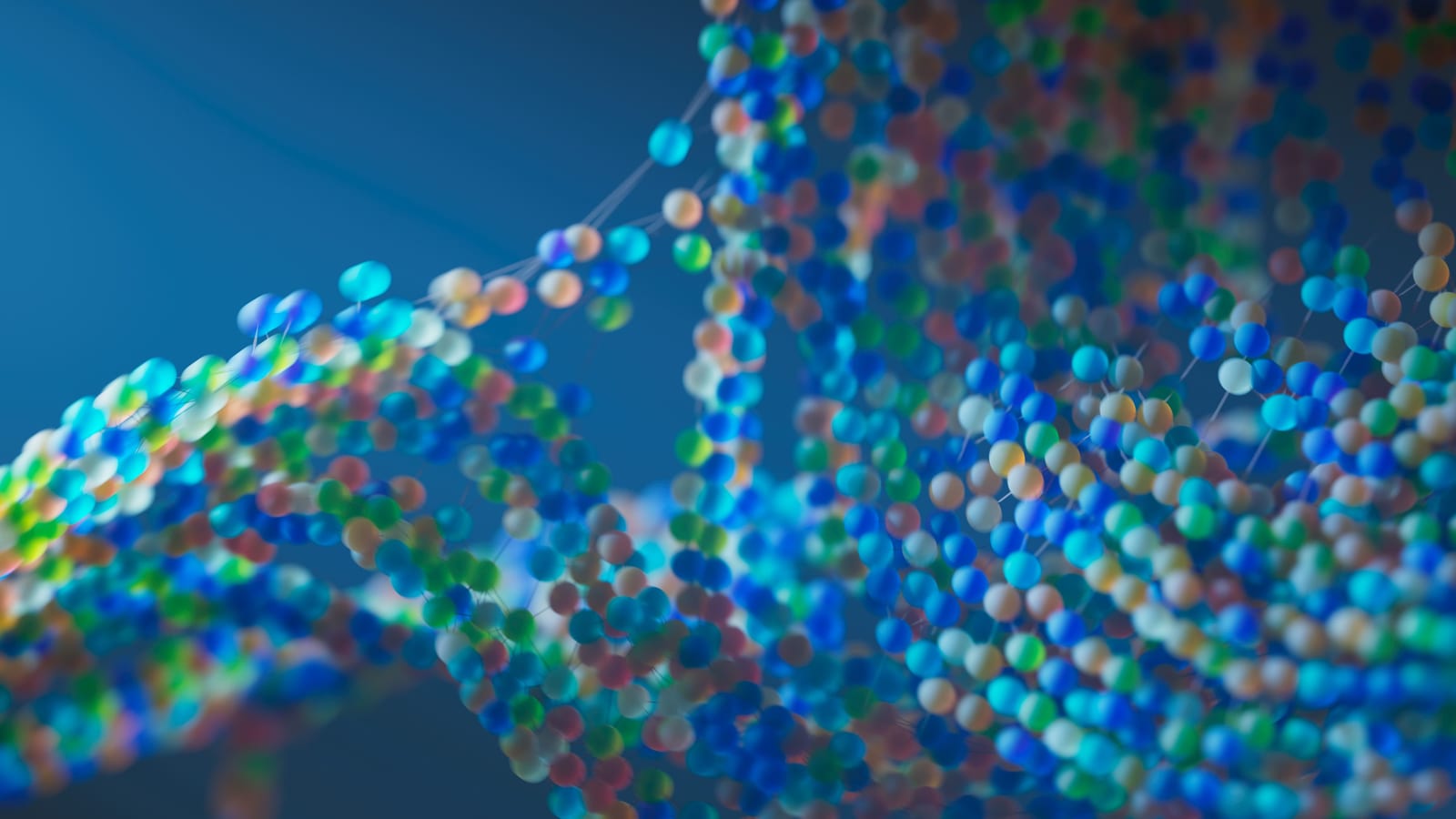 Abstract rendering of a double-helix strand built from coloured spheres