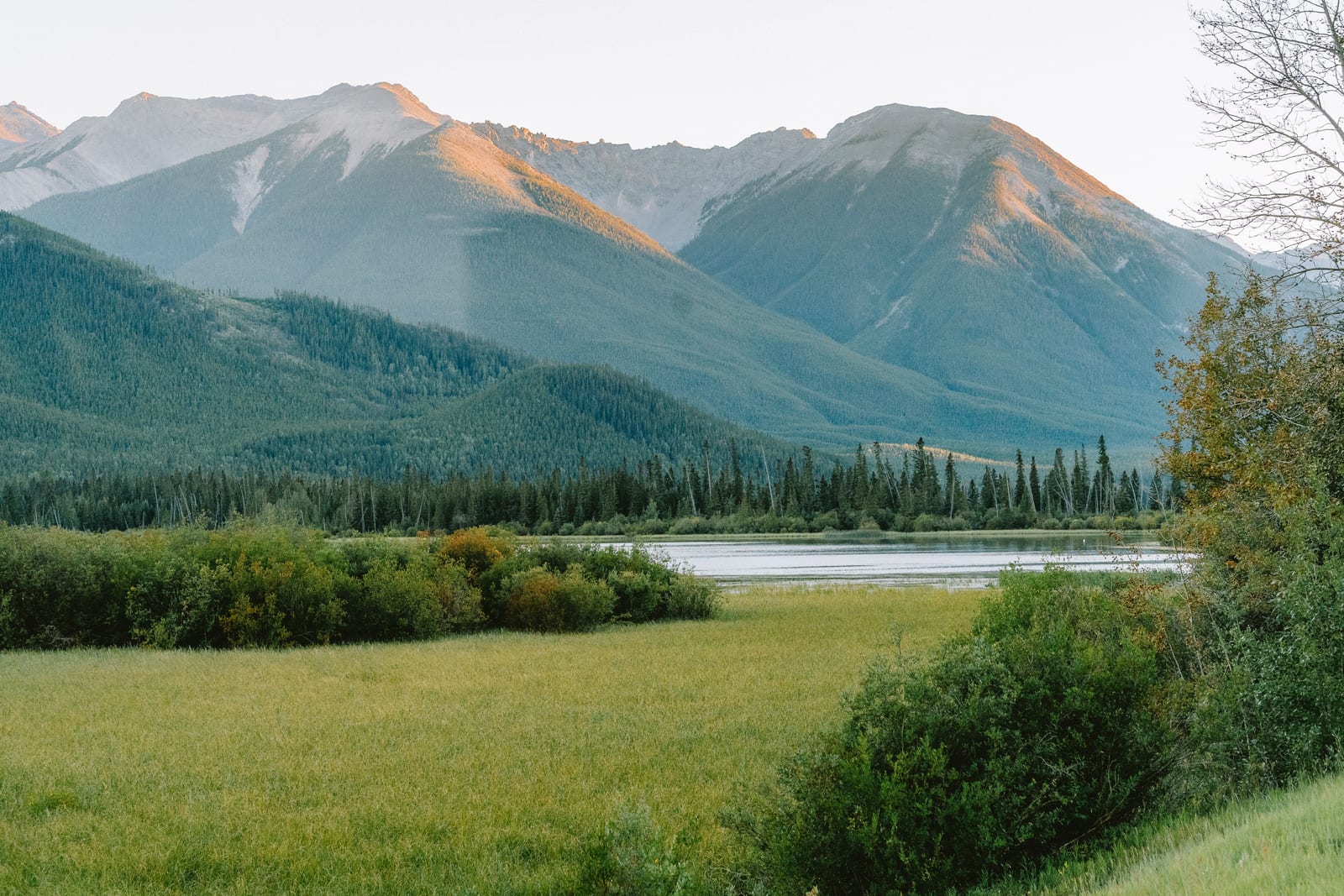 Calm mountain lake at first light